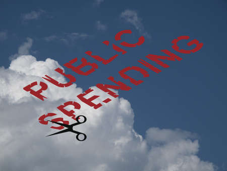 Conceptual representation of Government public spending cuts against a cloudy blue sky