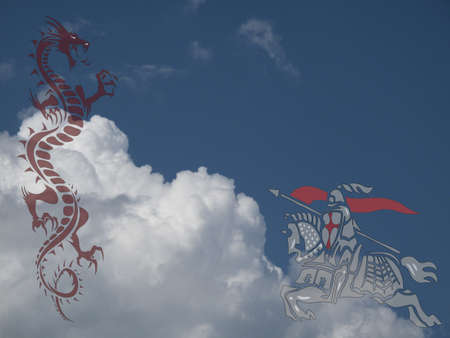 Saint George fighting the dragon against a cloudy blue skyの写真素材