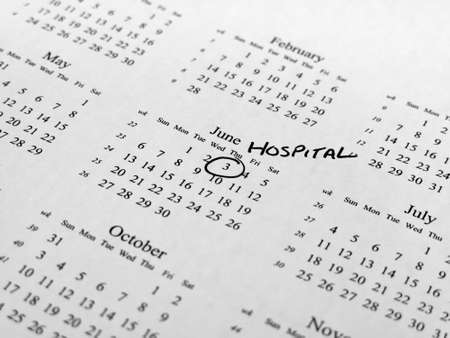 Generic calendar with hospital appointment circled with shallow  depth of field centred on highlighted dateの写真素材
