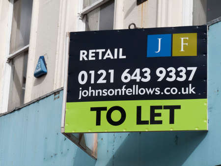 Commercial vacant shop to let sign over retail unit