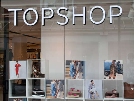 Topshop ladies high street fashion store sign and window display, part of the Arcadia Group owned by Sir Philip Nigel Ross Greenのeditorial素材
