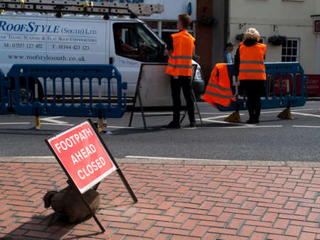 Wokingham, Peach Street, Berkshire, England - June 3, 2017: Contractors pathway closed sign due to construction worksのeditorial素材