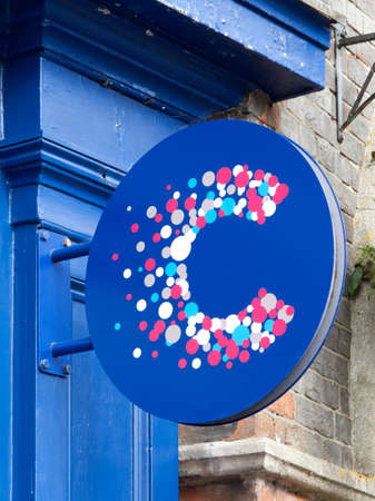 ancer Research UK sign over charity shop, the worlds largest independent cancer research charityのeditorial素材