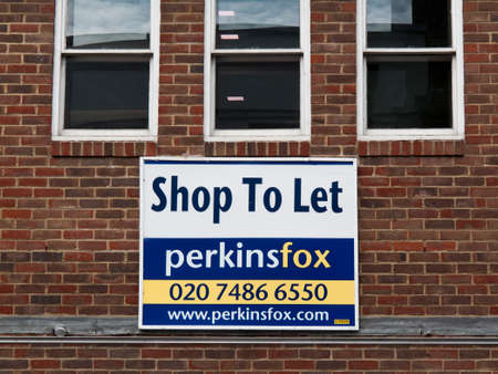 Estate Agent shop to let sign over vacant retail propertyのeditorial素材