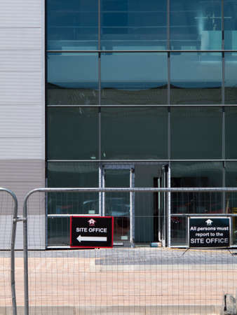 Site Office sign mounted on security fencing, new commercial warehouse and office developmentのeditorial素材