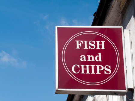 Sign over premises advertising the traditional English cuisine of fish and chips