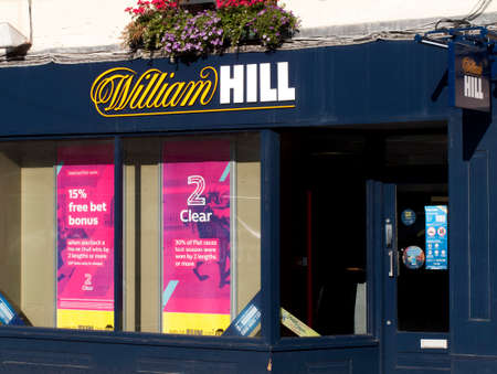 William Hill bookmakers sign, company founded by William Hill in 1934 at a time when gambling was illegal in Britainのeditorial素材