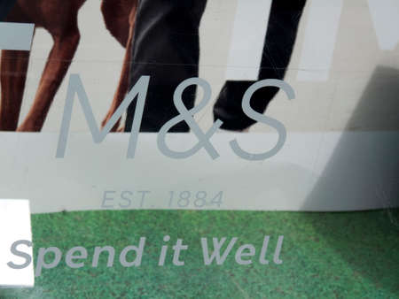 Marks and Spenser spend it well sign in shop window display, company founded in 1884 by Michael...
