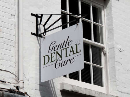 Gentle Dental Care sign over dentist premisesのeditorial素材
