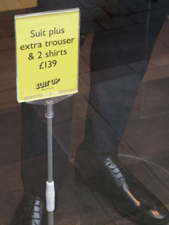 Moss Bros suit up Britain campaign advertising suit plus extra trouser and two shirts, UK Menswear Company founded in 1851by Mosses Mossのeditorial素材