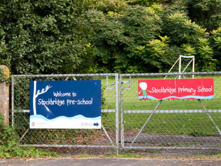 Welcome to Stockbridge pre school banner mounted on gate to playing fieldのeditorial素材