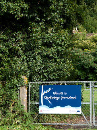 Welcome to Stockbridge pre school banner mounted on gate to playing fieldのeditorial素材
