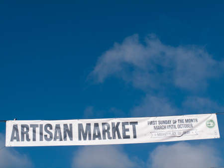 Artisan Market advertisement banner across street, organised by the city council, food, handmade arts and crafts, jewellery, home furnishingのeditorial素材
