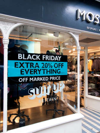 Salisbury, Wiltshire, England - November 22, 2017: Moss Bros Black Friday signs in high street stores advertising price discountsのeditorial素材