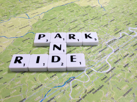 car park and ride scheme with public transport connections designed to alleviate traffic congestion with London map backgroundのeditorial素材