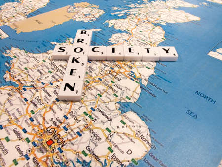 representation of broken society, a perceived or apparent general decline in moral values, with United Kingdom map backgroundのeditorial素材