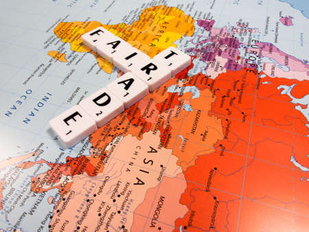representation of fair trade, to help producers in developing countries achieve better trading conditions, on world map backgroundのeditorial素材