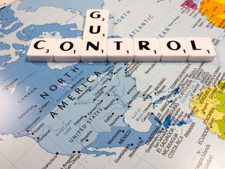 representation of gun control in the United States of America with USA map backgroundのeditorial素材