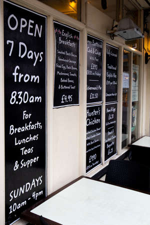 restaurant menu chalked on blackboard outside premises