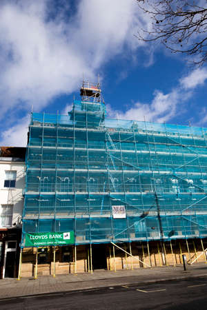 scaffolding with safety netting, renovation works being carried to Lloyds Bank building exteriorのeditorial素材