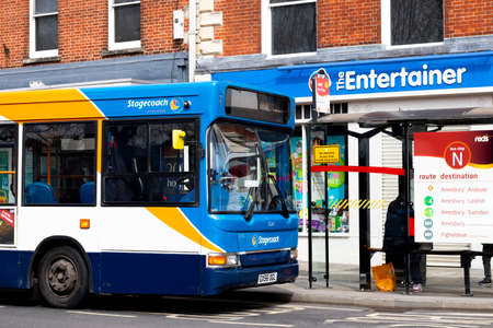 Stagecoach bus parked at passenger stop located in City centre shopping area