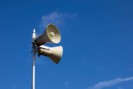 PA public address system speakers fixed to timber telegraph poleのeditorial素材