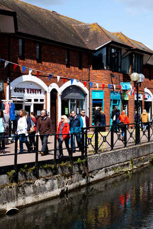 The Maltings shopping complex with retail units alongside the river Avon