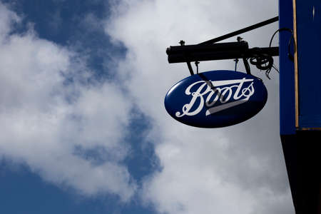 Boots the Chemist sign over shop premises, health and beauty retailer and pharmacy chain in the United Kingdomのeditorial素材