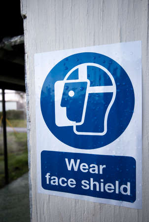 Mandatory construction health and safety wear face shield signの写真素材