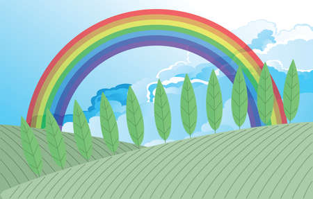 Colorful rainbow over countryside farmland ploughed field with a cloudy skyの写真素材