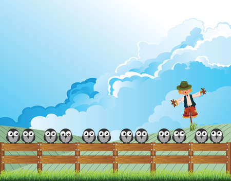 Apprehensive flock of birds perched on a fence deterred from feeding on farmers land by a scarecrow with cloudy blue sky aboveの写真素材