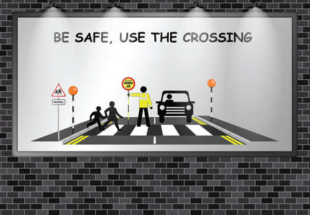 Illuminated advertising billboard with school be safe use the crossing message mounted on external brick wallの写真素材