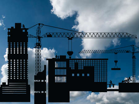 Silhouetted generic urban construction development set against a blue cloudy skyの写真素材