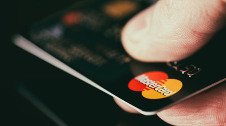 Plastic card Mastercard. Selective focus