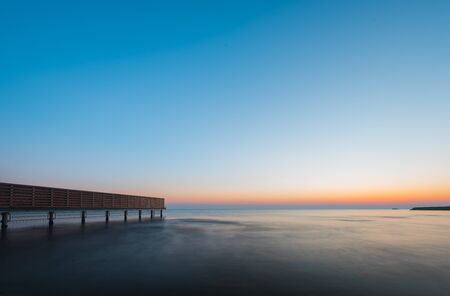 Bright colorful sunrise at seaの写真素材