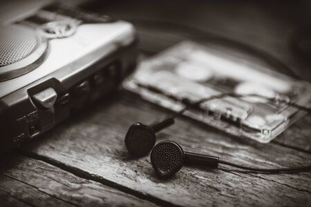 Vintage cassette player with earbuds and tape cassette.Retro style toned image. Selective focusの写真素材