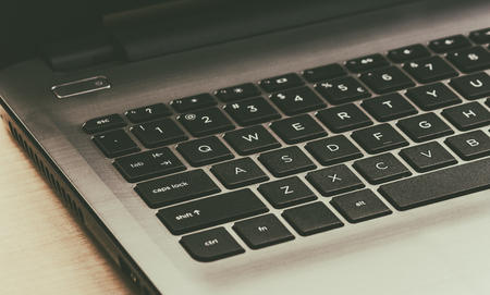 Laptop computer on a wooden background