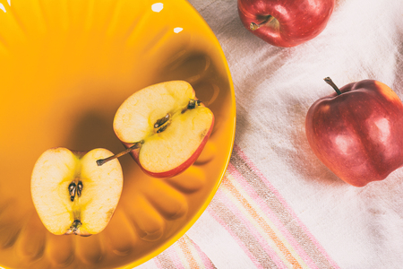 Fresh red apples on plateの写真素材