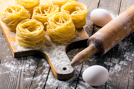 Homemade pasta on a wooden backgroundの写真素材