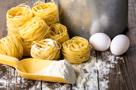 Cooking of pasta on a wooden backgroundの写真素材