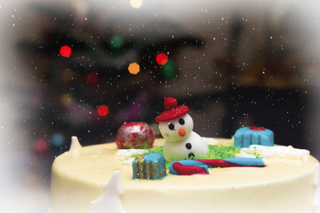 Homemade Christmas creamy cake, decorated with a Christmas charactersの写真素材