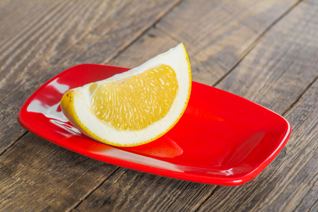 Grapefruit on a wooden tableの写真素材