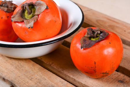 Juicy tropical persimmon fruitsの写真素材