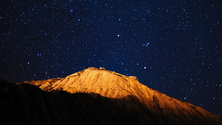 Mountain top in starry nightの写真素材