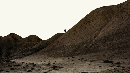 Nature photographer silhouette on a hillの写真素材