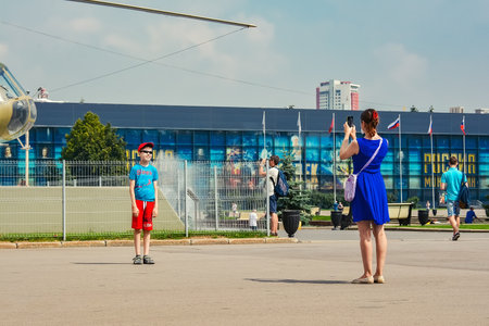 Russia, Moscow, May 11, 2018. People are photographed on exhibition complex VDNHのeditorial素材