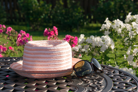 Hat and sunglasses on table, summer vacationの写真素材