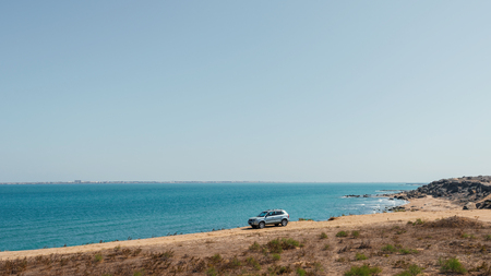 Crossover Hyundai Tucson on sea coastの写真素材