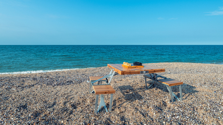 Chess board on the table by the seaの写真素材