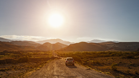 SUV on a dirt mountain roadの写真素材